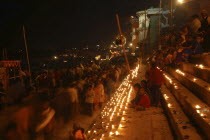 Deep Devali Festival on the ghats lining the Ganges River with festival goers lighting oil lamps
