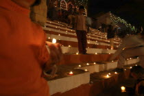 Deep Divali festival with oil lamps on the steps leading down to the Ganges River