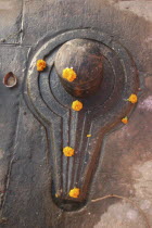 Shiva lingam decorated with marigolds near Chauki Ghat