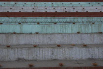 Deep Divali festival with close up view of oil lamps to be lit at night on steps leading down to the Ganges River
