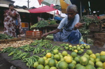 Pettah District. Female vendor selling limes  green chillies and vegetables