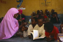 Female teacher and pupils at Dy Ayub Primary School.