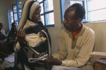 Male teacher with pupil at Fatima Bihi Primary School.