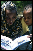 Children using new Somali textbooks produced by Unicef.