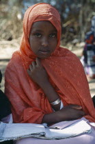 Young girl attending Koranic school.