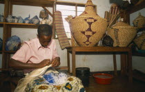 Refugee making traditional woven baskets.Refugees from the Congo and Rwanda fleeing conflict in Burundi Zaire
