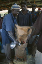 Mkugwa Refugee Camp.  Distribution of food aid supplying cornmeal from the United States of America.The Congo  Burundi and Rwanda Zaire