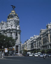 Alcala Grand Via Junction. View over road and traffic towards the Metropolis building.