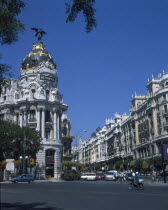 Alcala Grand Via Junction. View over road and traffic towards the Metropolis building.
