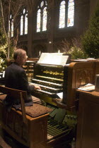 Basilica of St Mary organist playing music at the Christmas Pageant.