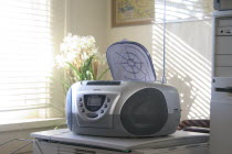 CD player next to desk in home office.