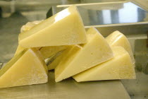 Wrapped wedges of Park brand Parmesan Cheese from Wisconsin ready to be weighed and priced at the Mississippi Market a natural foods co-op located at Dale and Selby.
