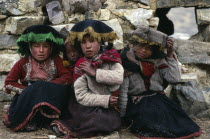 Portrait of three young girls from Pacchanta at the foot of Nevado Auzangate. Cuzco