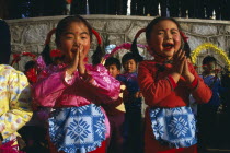 Two small girls performing song.