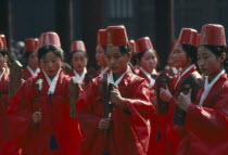 Sung Kyon Kwan University.  Sukcheon ceremony to consecrate confucius.  Dancing by traditional eigtht rows of eight carrying carved and painted rattles.