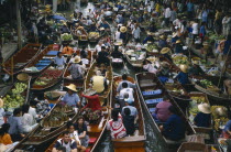 Busy scene in floating market near Bangkok.