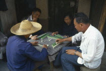 Playing game of majong.