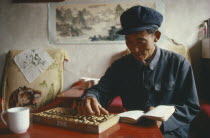 Farner using an abacus to do his accounts.