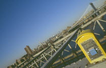 Manhattan and the Empire State building viewed from the walkway on the Brooklyn Bridge