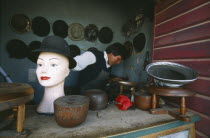 Hat maker in La Ceja making traditional brown and grey bowler hats known locally as a bombin.Gray