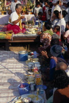 Shaman at ceremony smelling the offerings of food brought by the Khmer peopleAsian Cambodian Kampuchea Religion Southeast Asia Kamphuchea Religious