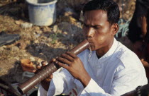 Traditional Khmer flautist accompanying shaman ceremonyAsian Cambodian Kampuchea Religion Southeast Asia Classic Classical Historical Kamphuchea Older Religious History