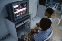 Two young boys playing a computer game in a shopping mall on Thanon SilomAsian Kids Prathet Thai Raja Anachakra Thai Shopping Centre Siam Southeast Asia 2 Center Immature Siamese Young Unripe Unripen...
