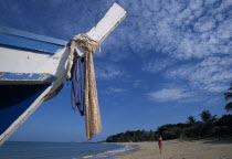 Relax Bay female tourist collecting shells on the beach with the bow of a fishing boat in the foregroundAsian Beaches Prathet Thai Raja Anachakra Thai Resort Sand Sandy Seaside Shore Siam Southeast A...