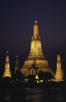 Wat Arun The Temple of The Dawn illuminated at sunsetAsian Prathet Thai Raja Anachakra Thai Religion Siam Southeast Asia Religious Siamese