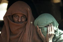 Portrait of two veiled Beja nomad women.
