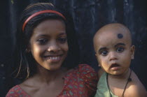 Young girl holding babyfamily Dacca