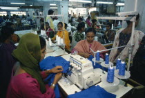 Female employees working in garment factory.