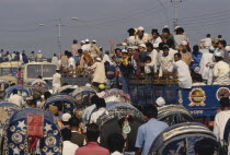 Trucks full of Muslim devotees returning from annual Biswa Itema gathering. Moslem