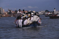 Overloaded country boat crossing the Buriganga River