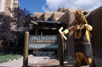 USA, New Mexico, Santa Fe, Wood carving at the entrance to the Loretto Chapel, built 1873.