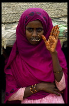 Beni Amer nomad woman with henna painted hand for marriage.