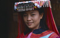 Portrait of Lisu girl wearing traditional head dress.