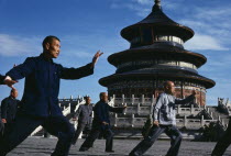 Group of men practising Tai Chi in front of the Temple of Heaven.  Peking