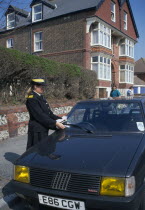 Car being given a parking ticket Automobile