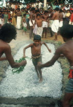 Young boys firewalking