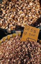 Wholesale Food Market.  Garlic cloves for sale displayed in woven baskets.Asian Prathet Thai Raja Anachakra Thai Siam Southeast Asia Siamese Northern Southern