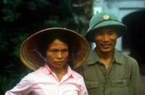 Wedding couple with the man in military uniform  by the Petit Lac.