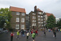 Victorian Junior School with young children in the playground.