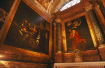 San Luigi dei Francesi  The french National Church built in the 16th century.  Interior view of Caravaggio s paintings: The Calling of St Matthew and St Matthew and the Angel painted between 1597 and...