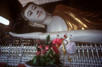 Shwethalyaung reclining Buddha.  Part view of head and arm.
