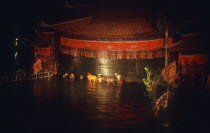 Water puppet theatre on Petit Lake at night.