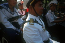 Soldiers at the 20th Anniversary parade commemorating the liberation of Saigon.  Close up shot  seated in vehicle.