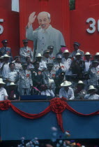 Liberation of Saigon 10th Anniversary celebration.  Generals gathered in front of a poster of Ho Chi Minh.