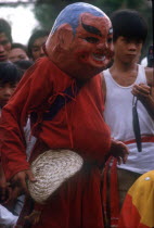 Dancer in carnival head at Ton San village  celebrating Tet Nguyen Dan  the Vietnamese New Year.