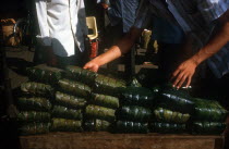 Tet delicacy of rice wrapped in banana leaves and steamed.